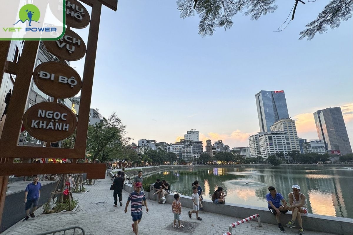 Take a relaxing walk along the green trees at Giang Vo Lake