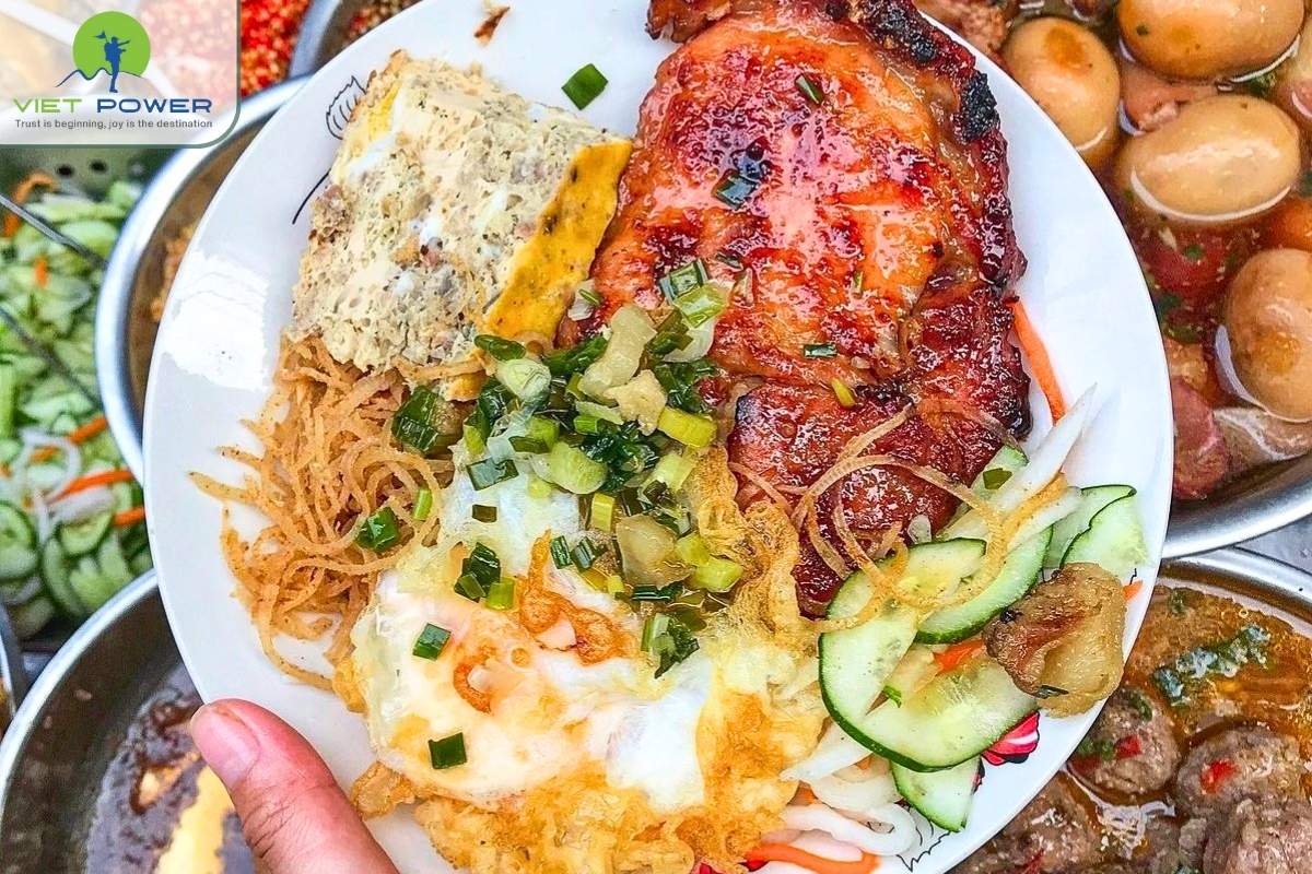 (2) A traditional plate of Com Tam Ho Chi Minh city with grilled pork and pickles